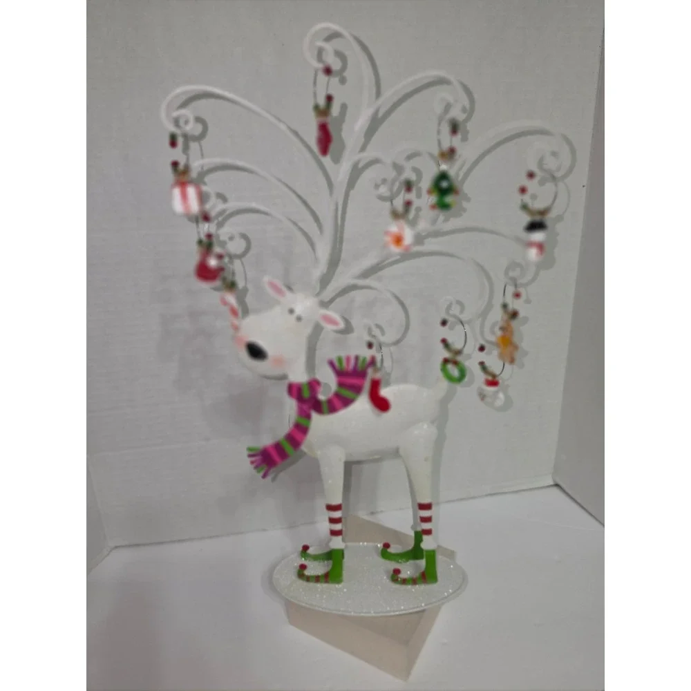 Pier 1 Imports reindeer wine charm‎ set featuring a decorative metal stand